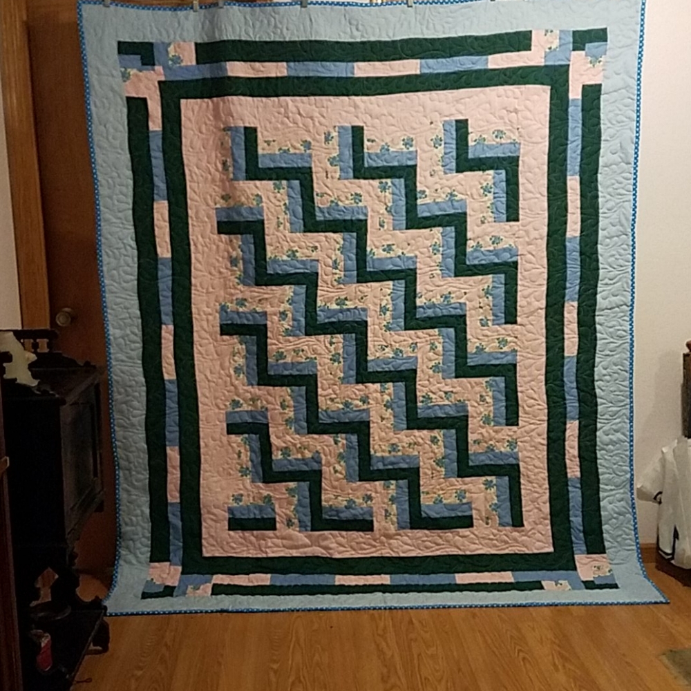 Hand made quilt blue,pink. and green